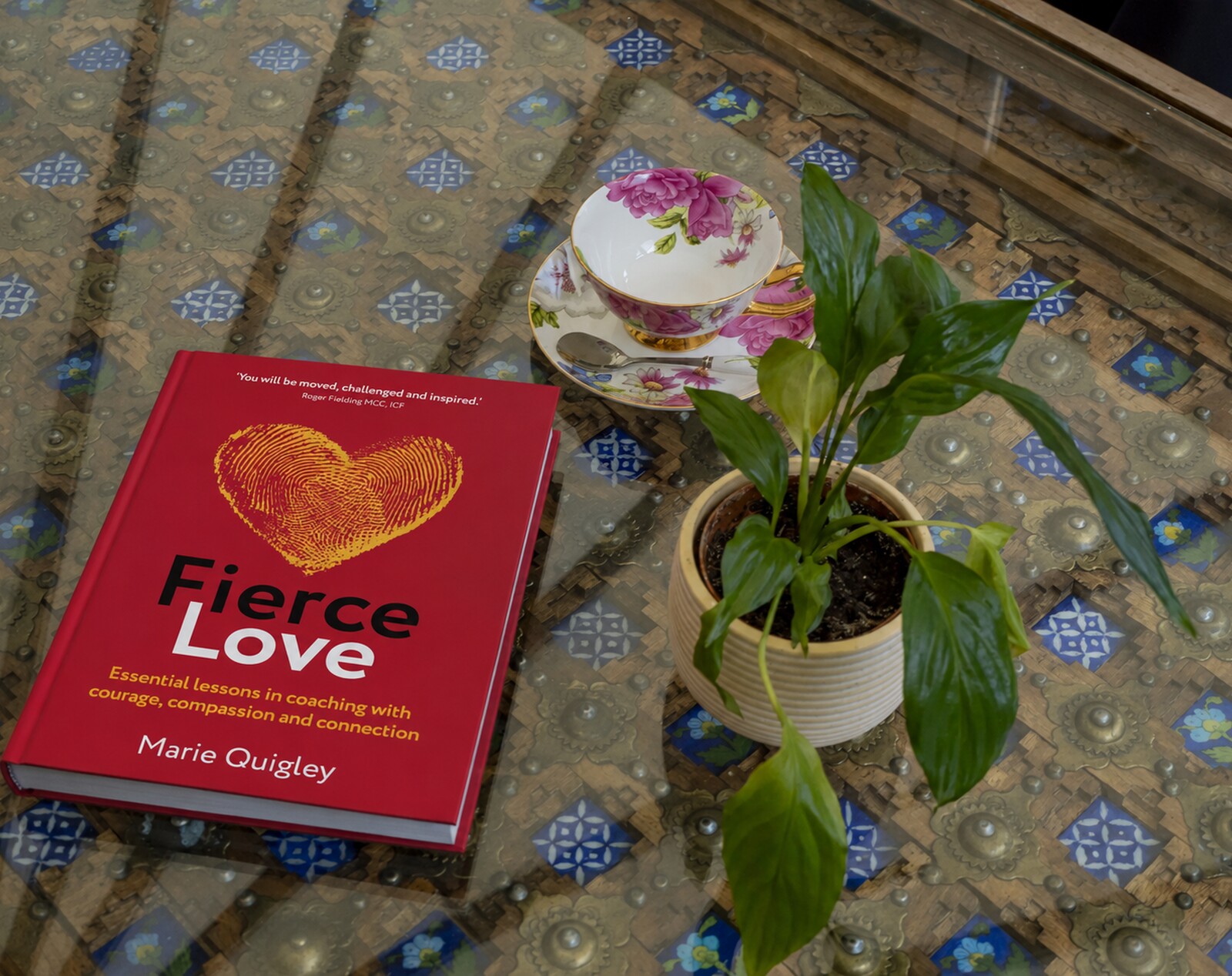 Fierce Love and Atlas of the Heart resting on a table